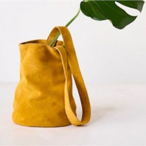 Free People Sundown Suede crossbody bag in Rich Amber